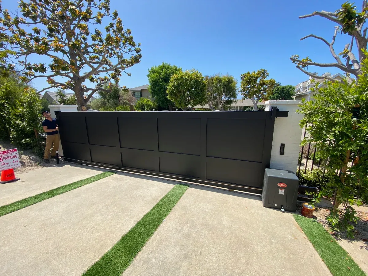 Gate operator and motor housing at a driveway gate