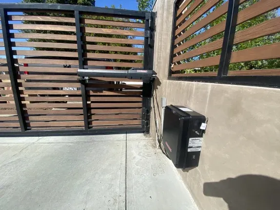 Automated dual swing gate